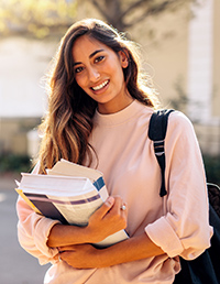Picture of pharmacy student holding books
