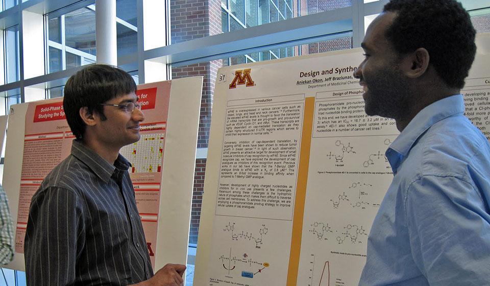 Two University of Minnesota students presenting information