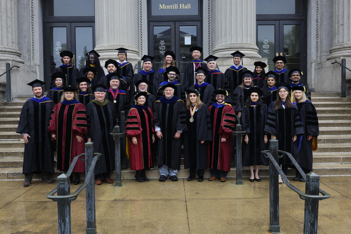 graduate students and professors in a group photo